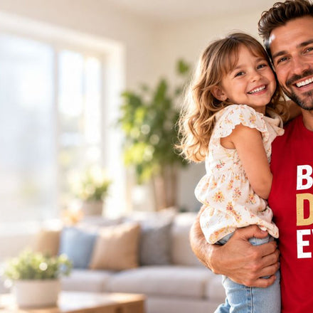 Dad in red Best Dad Ever t-shirt with his daughter